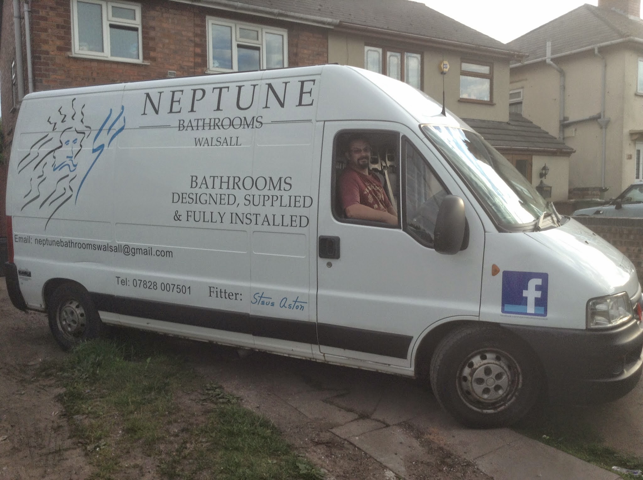 Steve Aston in the cab of his white Neptune Bathrooms Walsall van
